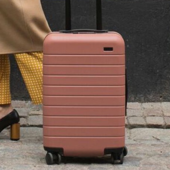 size of away bigger carry on